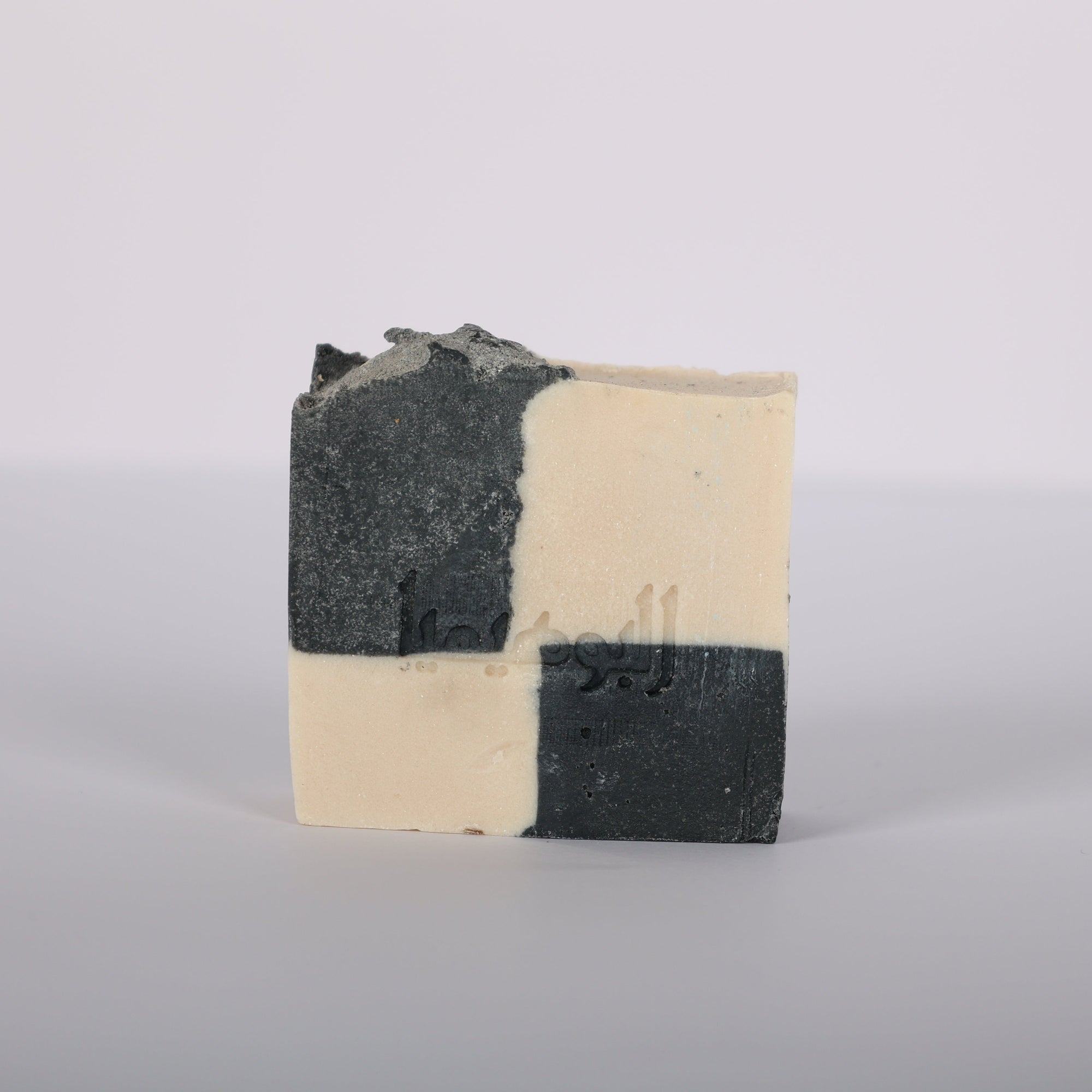 Domino Handcrafted artisanal soap with activated charcoal and musky scent natural ingredients