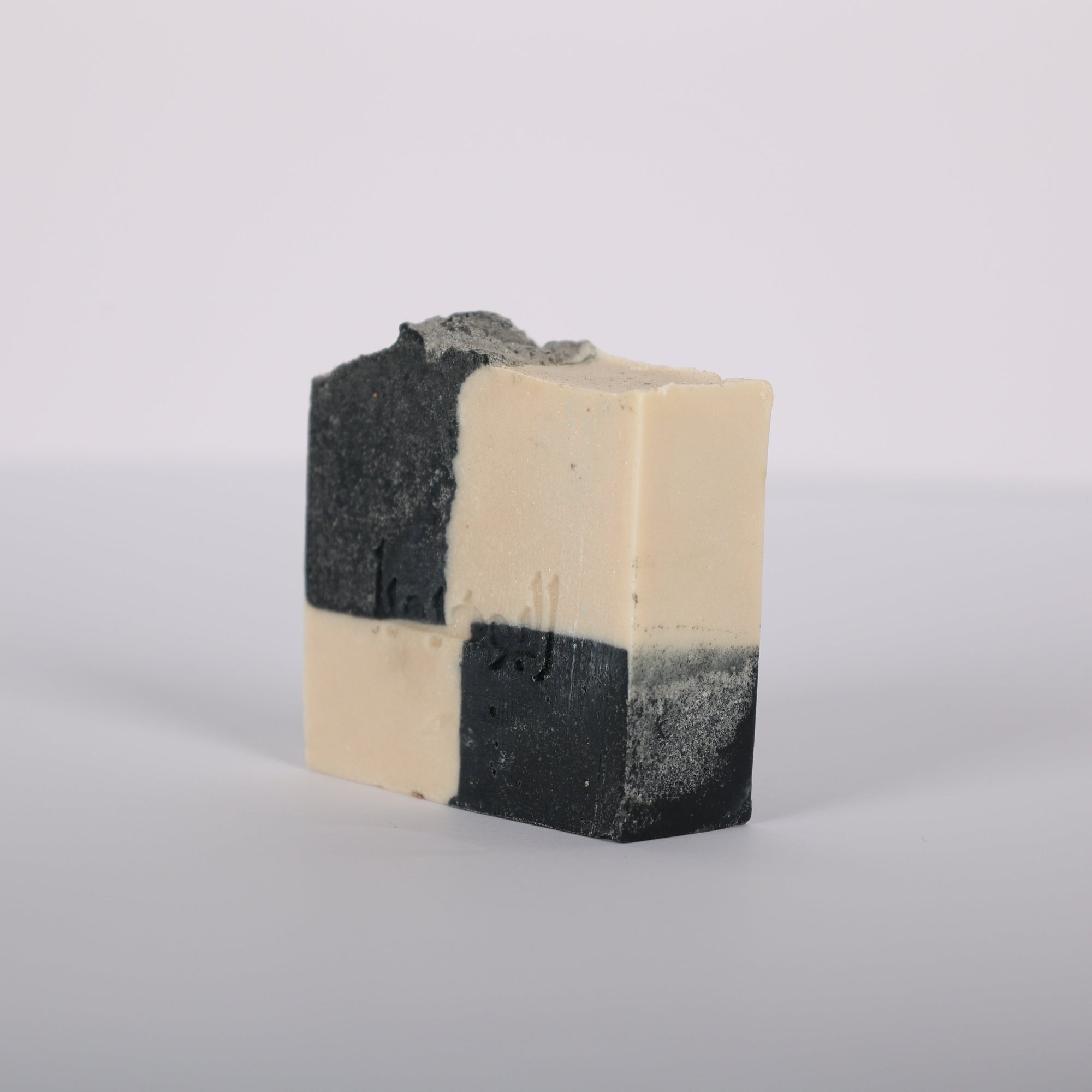 Domino Handcrafted artisanal soap with activated charcoal and musky scent natural ingredients