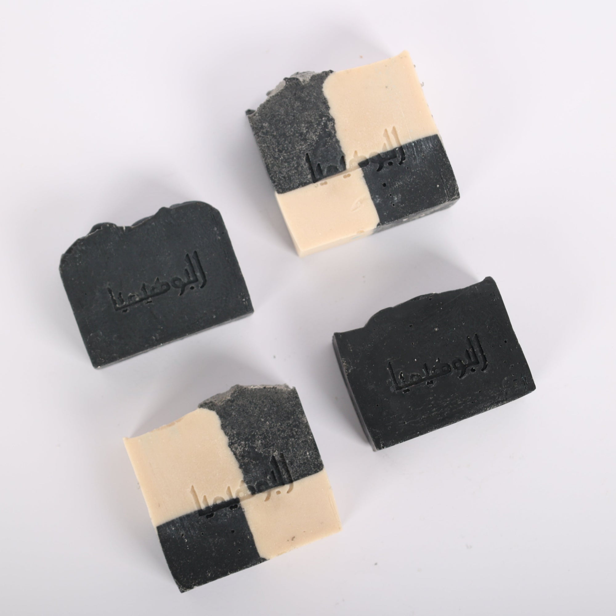 Handcrafted artisanal Yin Yang Detox Soap Kit with black charcoal and white musk soap bars