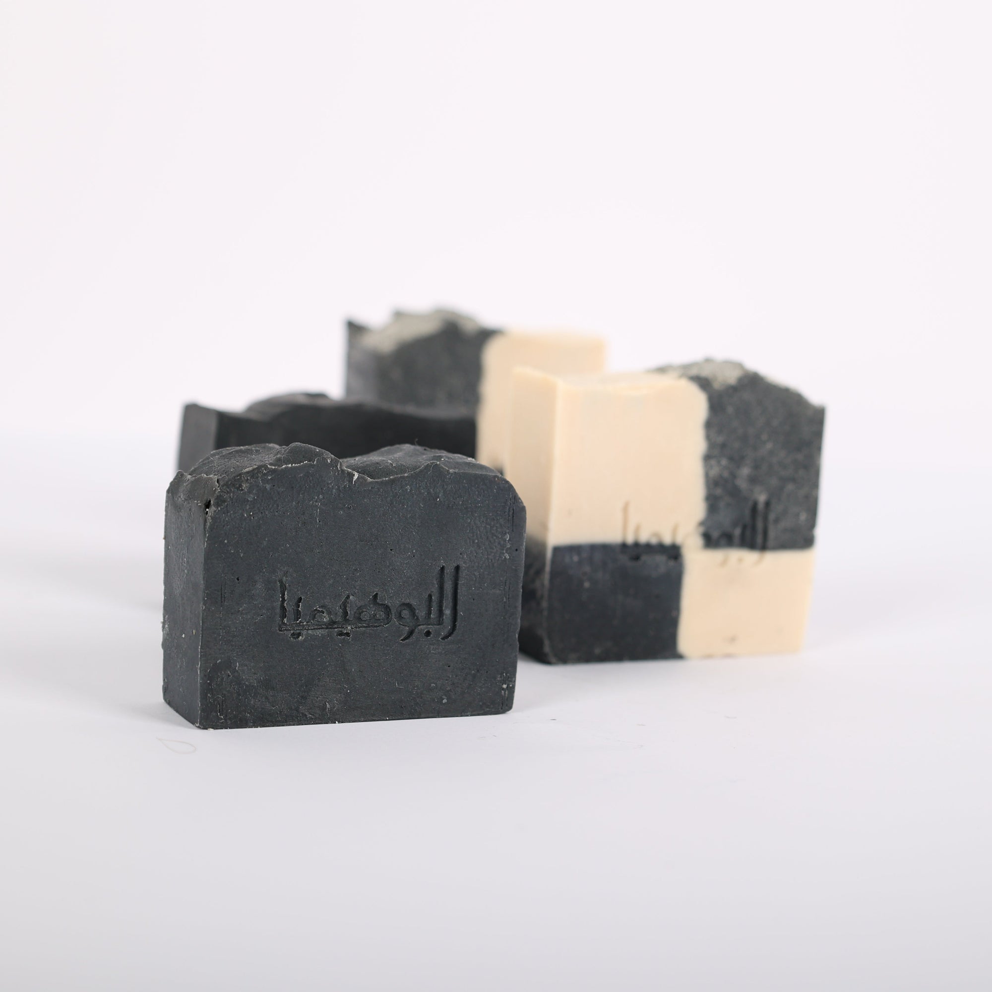 Handcrafted artisanal Yin Yang Detox Soap Kit with black charcoal and white musk soap bars