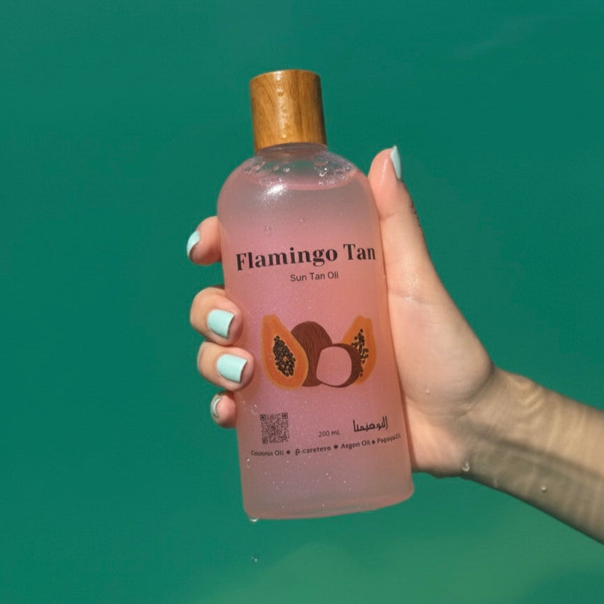Pink tanning body oil with papaya and vitamin E for glowing skin